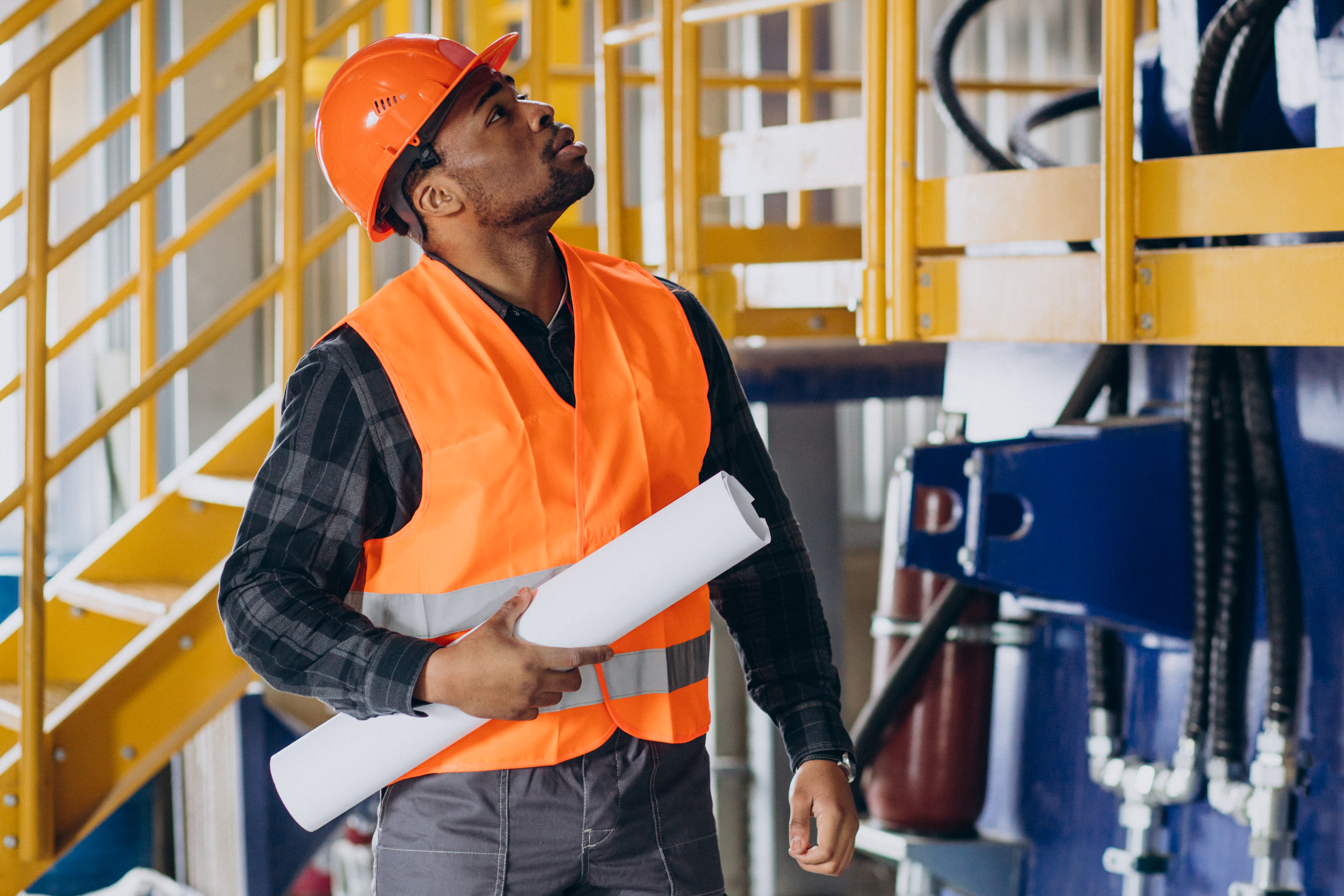 Construction supervisor reviewing plans on site